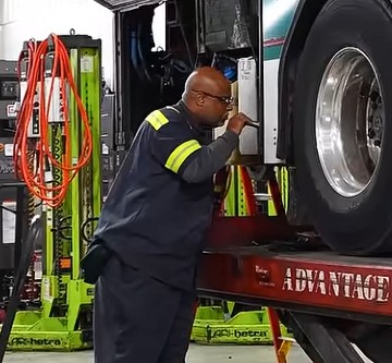 mechanic inspecting AC Transit bus