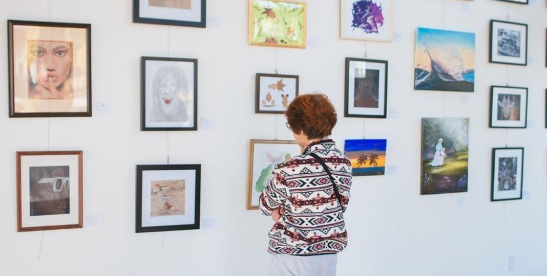 A woman looking at an art display