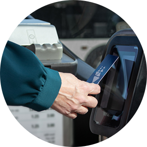 Clipper Card held against Clipper reader on AC Transit bus